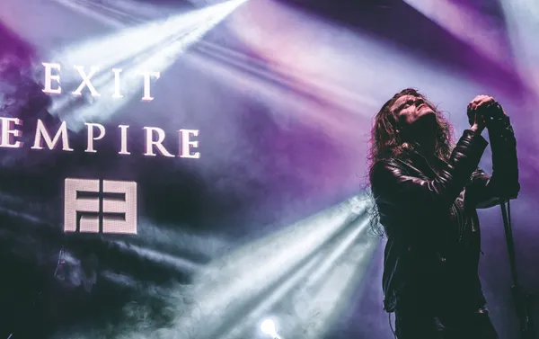 Exit Empire singer Rafael Eimut live in front of the band's backdrop