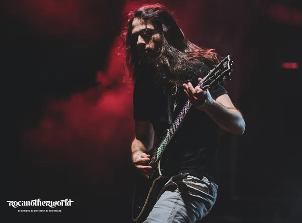 Exit Empire guitarist Timmy Ruzicka live at Rocanotherworld 2018, in red light